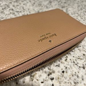 Tan large continental Kate Spade wallet.